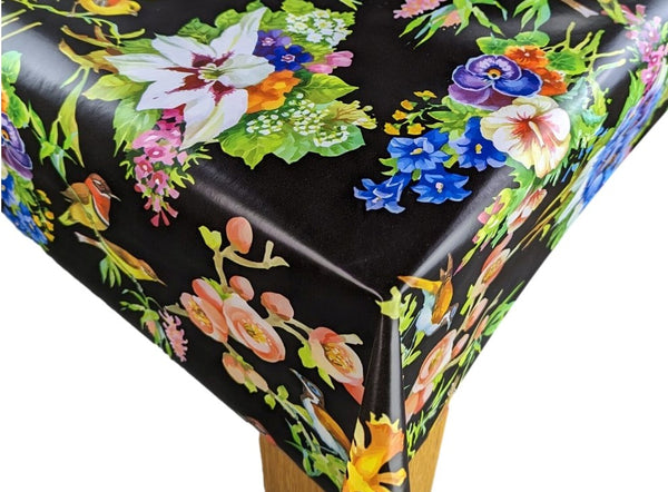 Bright Garden Birds and Flowers on Black Vinyl Tablecloth