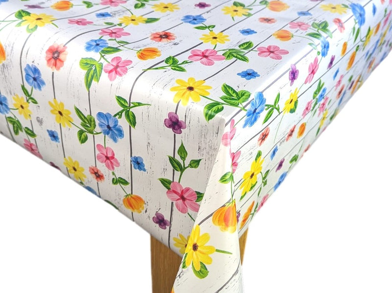 Bright Flowers on White Wood Effect Vinyl Tablecloth